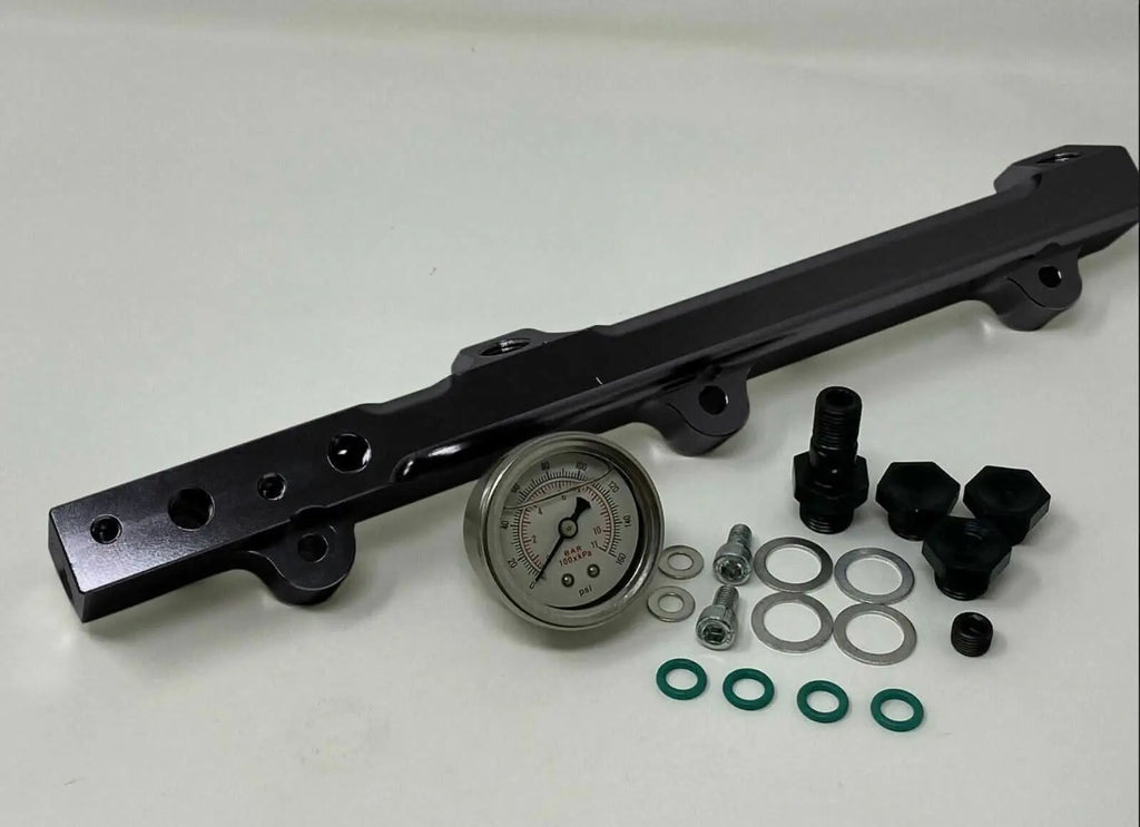 High flow fuel rail for Honda Prelude H22 H23 and Accord F22 engine, by Jack Spania Racing, with metal finish and mounting ports.