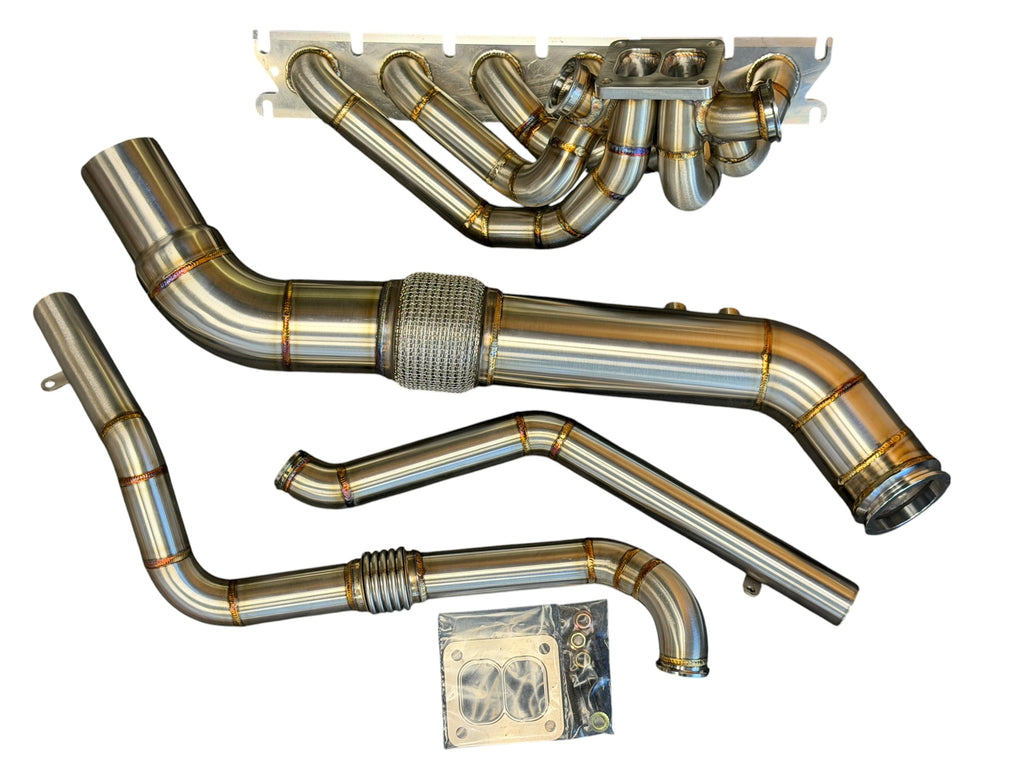 JackSpania Racing B58 Gen 2 6-port turbo hot-side kit installed on BMW M240i and Toyota GR Supra, showcasing turbo piping and fittings.