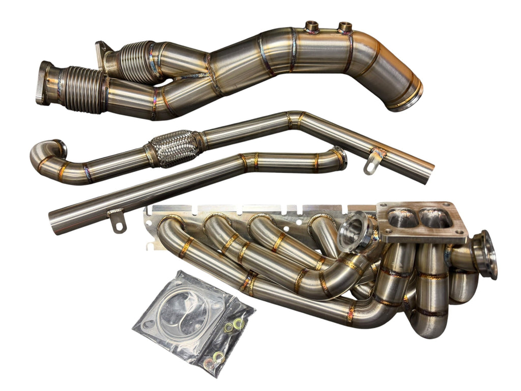BMW S58 G80 G82 G83 G87 single turbo manifold hot-side kit by JackSpania Racing, showing the polished metal exhaust manifold.