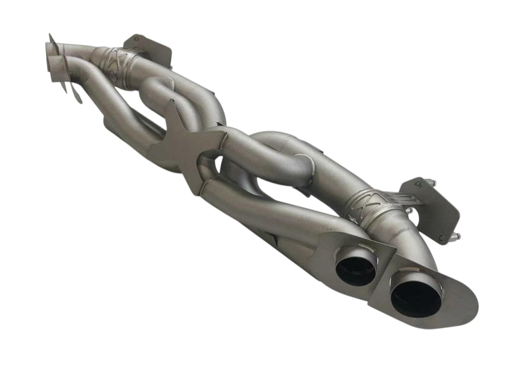 Titanium valved sport exhaust system for Porsche 992 Carrera and Turbo by JackSpania Racing, showing polished metal pipes and valves.