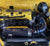 JackSpania Racing titanium K20 K24 3-inch pie cut cold air intake pipe with high flow filter installed on engine.